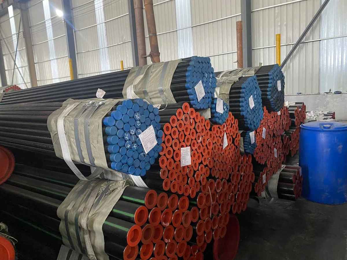 Carbon steel pipe bundles and pipe ends staged in a warehouse
